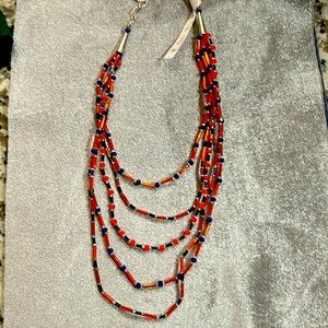 Orang & blue, multi strand necklace. Silver tone metal w/lobster clasp.